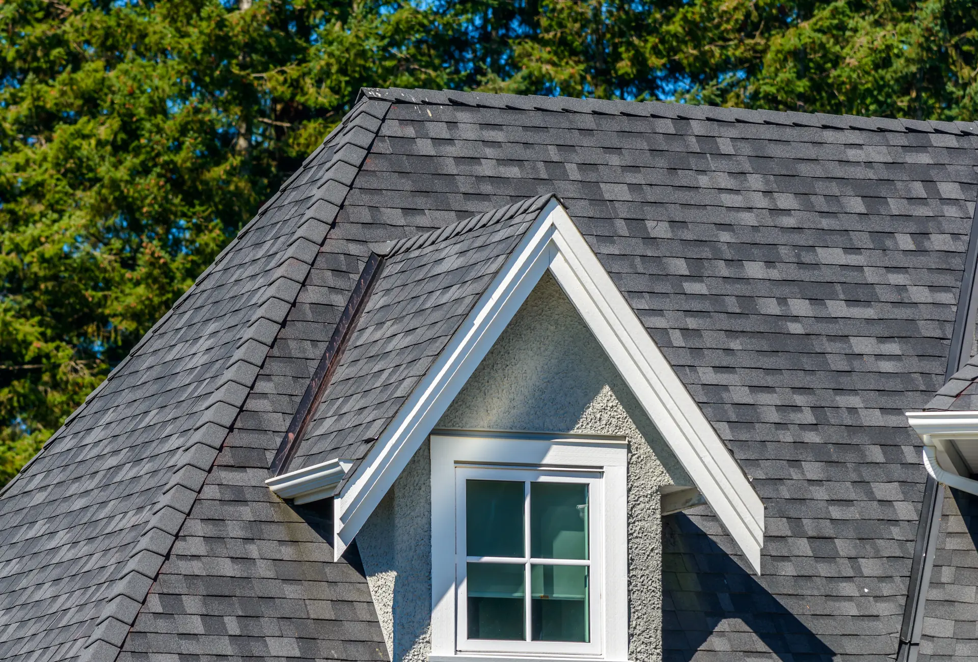Roofing crew installing architectural shingles in Aurora, CO